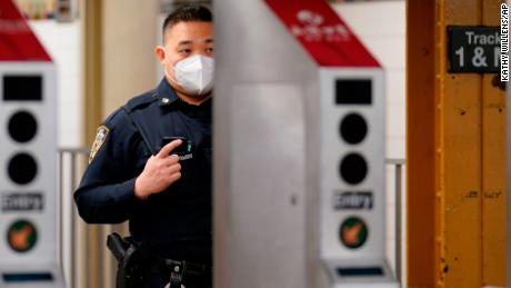 A law enforcement officer in New York is seen at a subway station on March 30, 2021, in the largely Asian American neighborhood of Flushing.