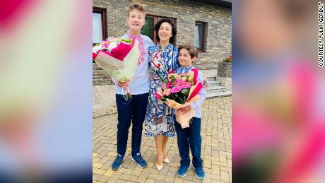 Yulia Gerbut and her two sons on September 1, 2021, on the first day of school in Ukraine.
