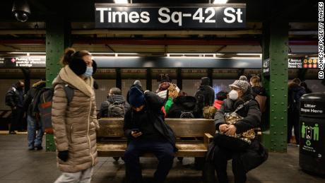 Commuters wait for a train at the Times Square subway station days after Michelle Go was pushed from a subway platform there and killed.