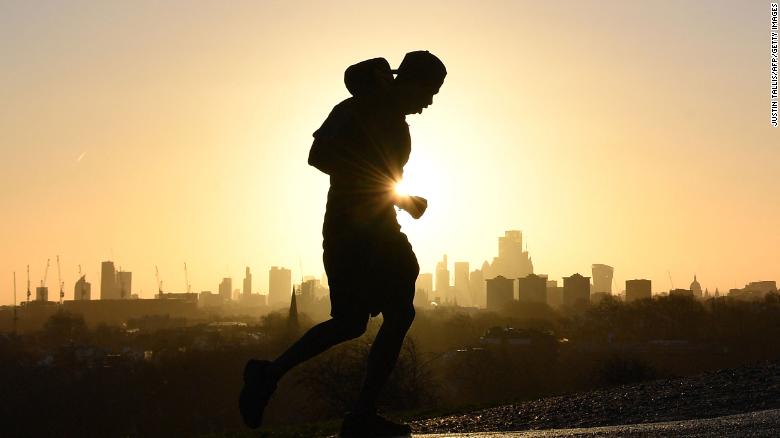 A full-body workout like running or swimming burns the most calories. A jogger runs up Primrose Hill in London on February 17.