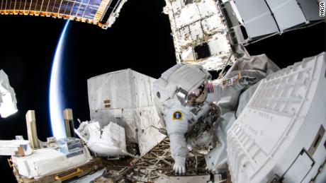 NASA astronauts conduct spacewalk to provide space station power upgrades