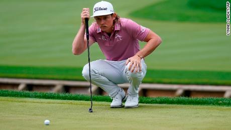 Smith lines up his putt on the fourth hole in the final round of the Players Championship.
