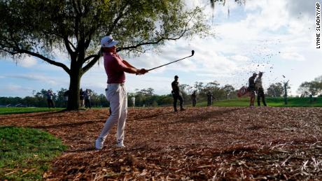 Smith comes out of the pine straw along the 18th fairway in the final round of the Players Championship.