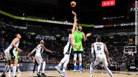 Towns shoots the ball during the game against the Spurs.