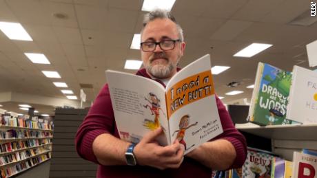 Toby Price reads a copy of the children&#39;s book &quot;I Need a New Butt!&quot; He was fired for reading the book to a second-grade class on March 2, 2022. 
