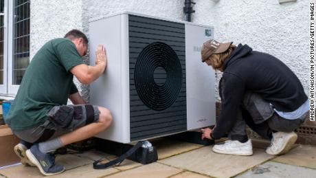 Workers install a heat pump in Folkestone, England. 