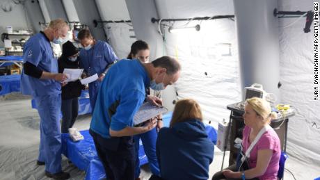 A field hospital set up by medical staff with US evangelical Christian disaster relief nonprofit Samaritan&#39;s Purse operates Monday in an underground parking lot of the King Cross Leopolis shopping mall in the settlement of Sokilnyky near the western Ukrainian city of Lviv.