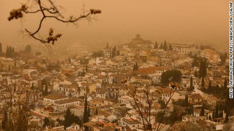 Hazy skies from the Saharan dust plume in Granada, Spain, on Tuesday. 