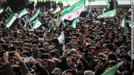Syrians in the city of Idlib take part in a protest against the Syrian regime on March 14 to mark the 11th anniversary of the Syrian uprising.   