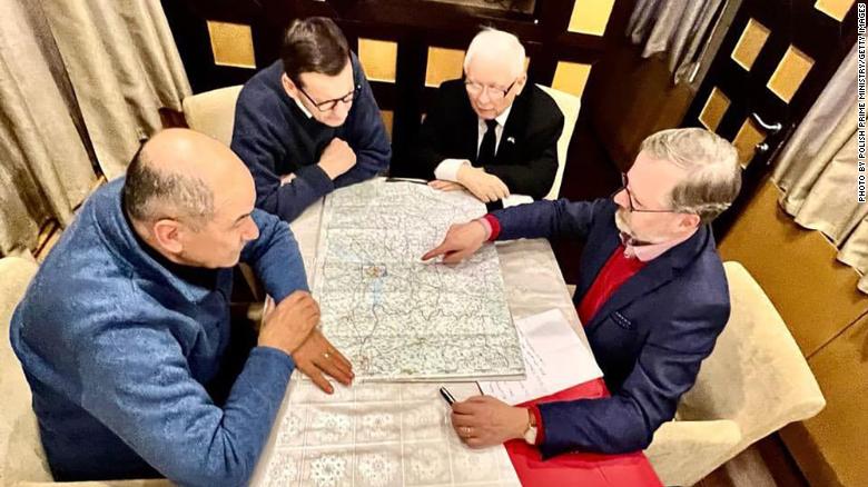 From left: Slovenia&#39;s Prime Minister Janez Janša, Polish Prime Minister Mateusz Morawiecki, Polish deputy Prime Minister Jarosław Kaczyński and Czech Prime Minister Petr Fiala study a map of Ukraine in an undisclosed location Tuesday.