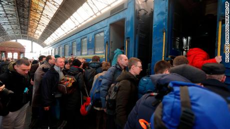 Passengers board a train in Lviv, Ukraine, on March 15.