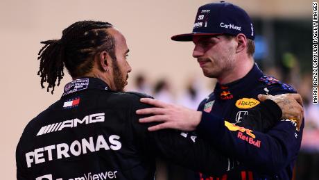 2021 F1 World Drivers Champion Max Verstappen is congratulated by runner up Lewis Hamilton after the Abu Dhabi Grand Prix. 