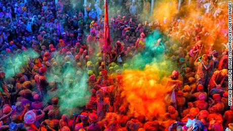 People in the Indian state of Uttar Pradesh play with colorful powders (gulal) during Holi.