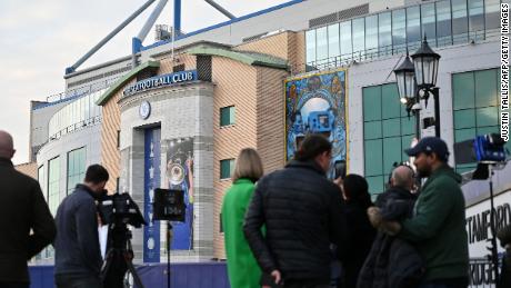 Members of the media work outside Chelsea&#39;s Stamford Bridge stadium in London on March 10, 2022.