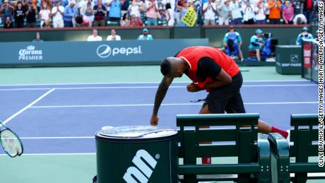 Nick Kyrgios smashes his racket after his three-set defeat to Rafael Nadal.