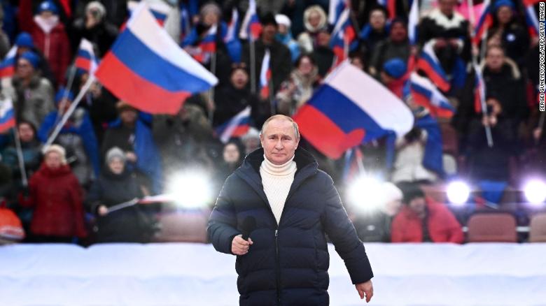 Russian President Vladimir Putin attends a concert marking the eighth anniversary of Russia&#39;s annexation of Crimea at the Luzhniki stadium in Moscow on March 18, 2022. 