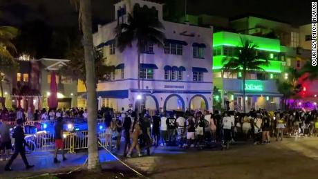 Miami Beach imposed a midnight spring break curfew after two shootings left five people injured.