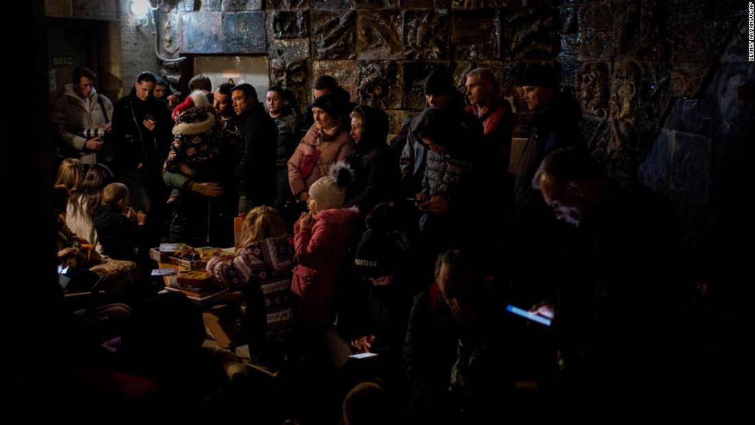 People gather in a basement during an air raid in Lviv on March 19.