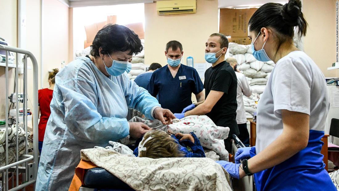 Staff members attend to a child at a children&#39;s hospital in Zaporizhzhia on March 18.