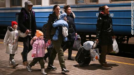 People arrive from Ukraine on Sunday at Przemysl station in Poland.