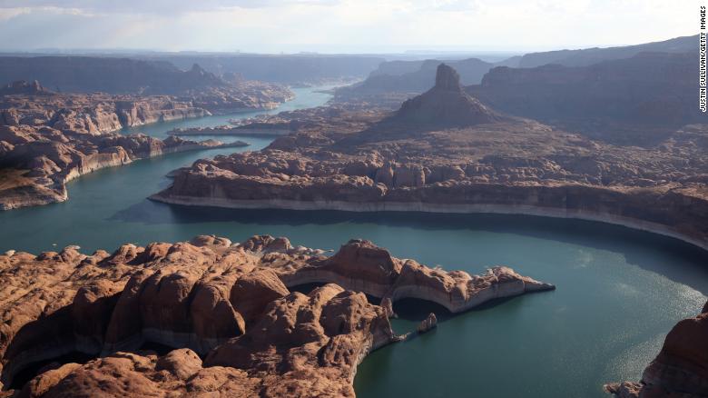 Not only is Lake Powell’s water level plummeting because of drought, its total capacity is shrinking, too