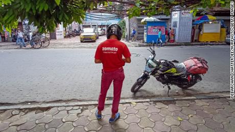A Zomato food delivery partner is seen on a road in Kolkata, India, on July 14, 2021.