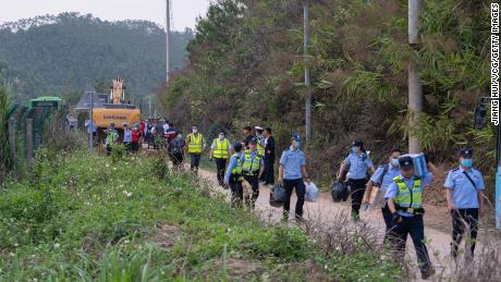 Rescuers at the crash site on March 21.