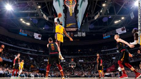 LeBron James posterizes Kevin Love in the Lakers&#39; solid victory over the Cavs.