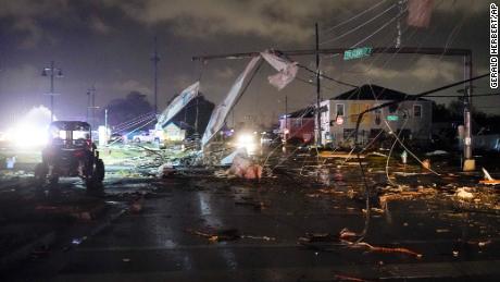 A debris-lined street is seen in the Lower Ninth Ward, Tuesday, March 22, 2022, in New Orleans, after strong storms moved through the area.
