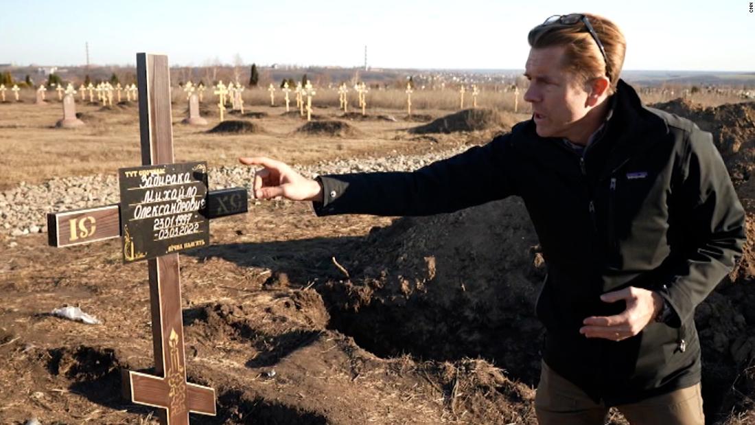 CNN goes to gravesite and makeshift morgue for war dead – CNN Video