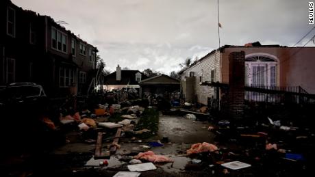 Debris is strewn across the ground in the Arabi neighborhood after a large tornado hit the New Orleans area Tuesday.