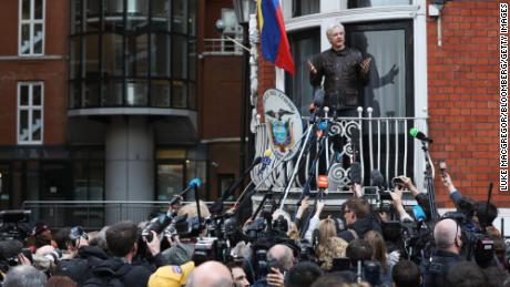 Julian Assange, founder of WikiLeaks, speaks to media and supporters from a balcony at the Ecuadorian embassy in London on Friday, May 19, 2017. 