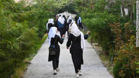 Girls arrive at their school in Kabul on March 23, 2022. (Ahmad Sahel Arman/AFP/Getty Images)