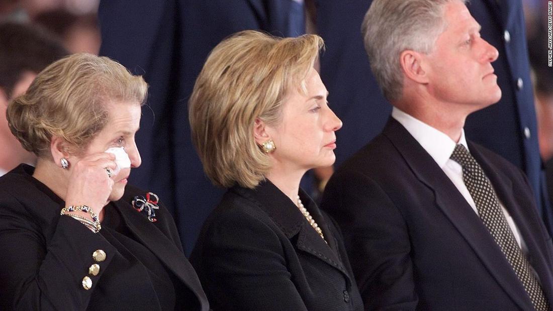 Albright wipes away a tear as she and the Clintons attend a memorial ceremony for US citizens who were killed in an embassy bombing in Kenya in 1998.