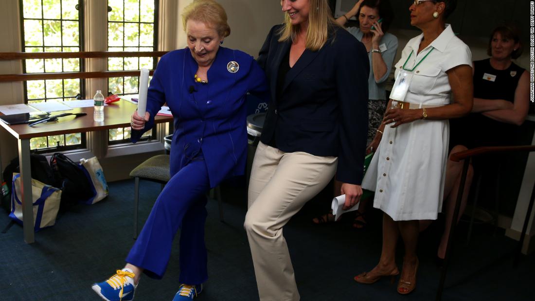 Albright shows off her sneakers with Olympic athlete Angela Ruggiero as they attended an alumni weekend at Wellesley College in 2014.