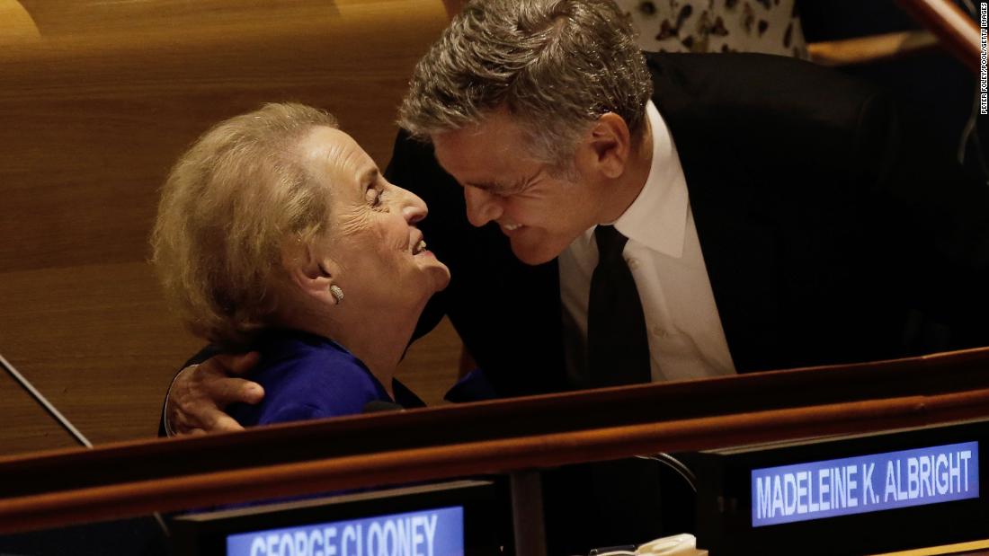 Actor George Clooney embraces Albright at the United Nations headquarters in 2016. They were attending a Leaders Summit for Refugees.