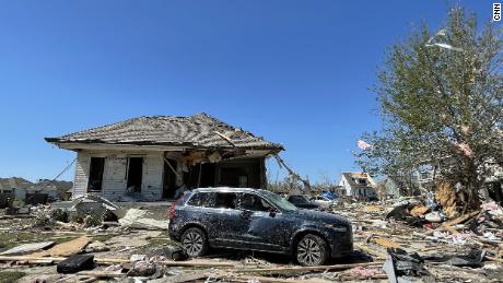 Crews travel through devastated neighborhoods in the New Orleans area after a tornado killed 1 and left thousands without power