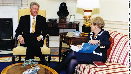US President Bill Clinton (left) and Secretary of State Madeleine Albright talk together in the White House's Oval Office, Washington DC, September 8, 1997.