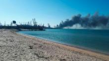 Smoke rises after shelling near a seaport in Berdyansk, Ukraine, Thursday, March 24, 2022. Ukraine&#39;s navy reported Thursday that it had sunk the Russian ship Orsk in the Sea of Asov near the port city of Berdyansk. It released photos and video of fire and thick smoke coming from the port area. Russia did not immediately comment on the claim. (AP Photo)