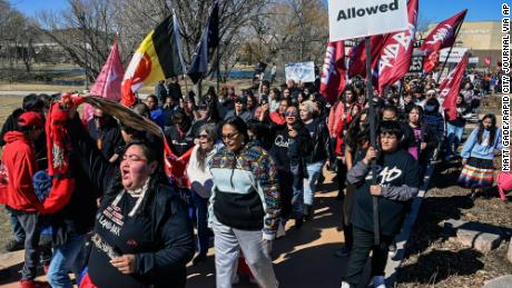 Indigenous rights activists and others marched in Rapid City, South Dakota, on Wednesday after a local hotel was accused of declining to serve Native Americans.