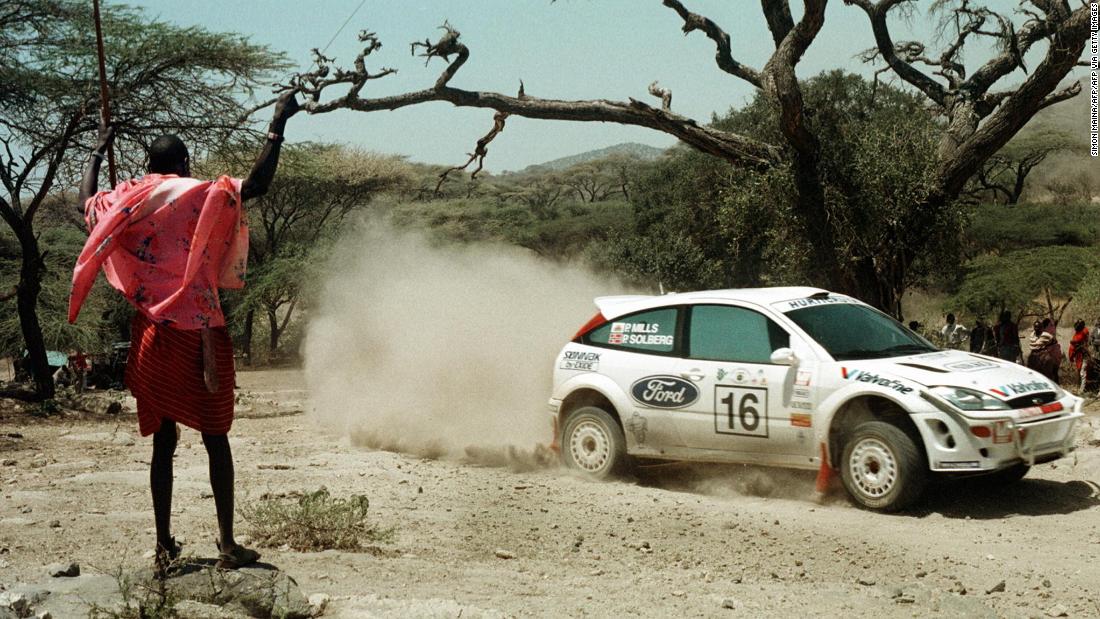 A Maasai warrior watches Petter&lt;strong&gt; &lt;/strong&gt;Solberg and Phil Mills compete in the first leg of the 2000 &lt;a href=&quot;https://www.ewrc-results.com/entryinfo/110-sameer-safari-rally-kenya-2000/7159/&quot; target=&quot;_blank&quot;&gt;Sameer Safari Rally&lt;/a&gt;, south of Nairobi. The Norwegian and Briton would finish fifth in the three-day World Rally Championship event.