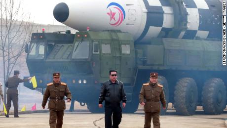 This picture by North Korea's official Korean Central News on March 25 purportedly shows leader Kim Jong Un walking near what state media reported was a new type intercontinental ballistic missile.  Experts doubt the claims.