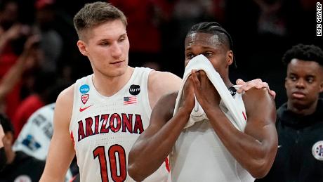 Arizona forward Azuolas Tubelis and guard Bennedict Mathurin leave the court after their loss to Houston.
