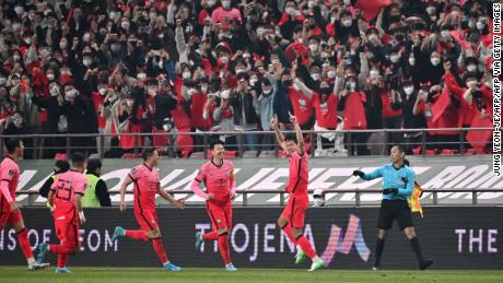 South Korea&#39;s Kim Young-gwon celebrates his goal in front of fans. 