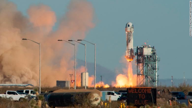 A Blue Origin New Shepard rocket launches on December 11, 2021, in West Texas near Van Horn. 