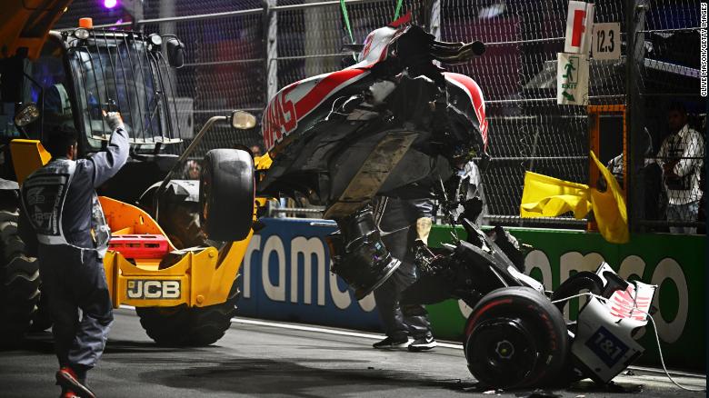 Track marshals clean debris from the track following Mick Schumacher&#39;s crash during qualifying ahead of the F1 Grand Prix of Saudi Arabia at the Jeddah Corniche Circuit on March 26, 2022, in Jeddah, Saudi Arabia.