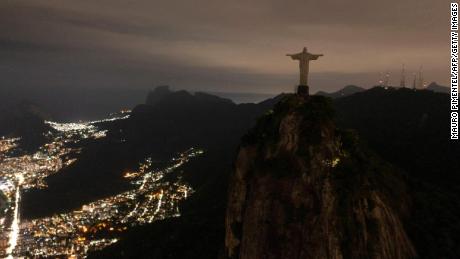 The statue of Christ the Redeemer is seen after being plunged into darkness for the Earth Hour environmental campaign on top of Corcovado hill in Rio de Janeiro, Brazil, on March 26, 2022. 
