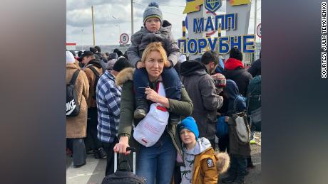 Julia Temchenko and her two young boys Milan (5) and Edvard (3) flee their war-torn country of Ukraine. Seen here at the Poland border before entry to safety.