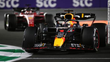 Verstappen drives in front of LeClerc. 