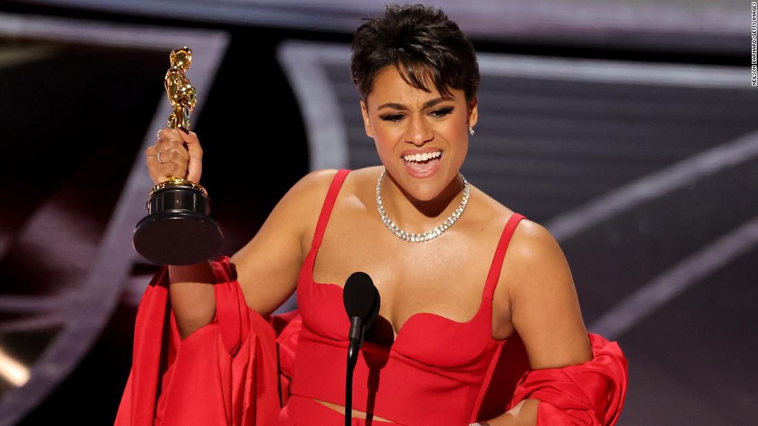 Ariana DeBose accepts the Oscar for best supporting actress. DeBose won for her role in the musical &quot;West Side Story.&quot; She is &lt;a href=&quot;https://www.cnn.com/entertainment/live-news/oscars-2022/h_6d32db026e33a138b2040def0c1e3b26&quot; target=&quot;_blank&quot;&gt;the first openly queer woman of color to win in this category.&lt;/a&gt; &quot;For anyone who has ever questioned their identity, there is indeed a place for us,&quot; she said.